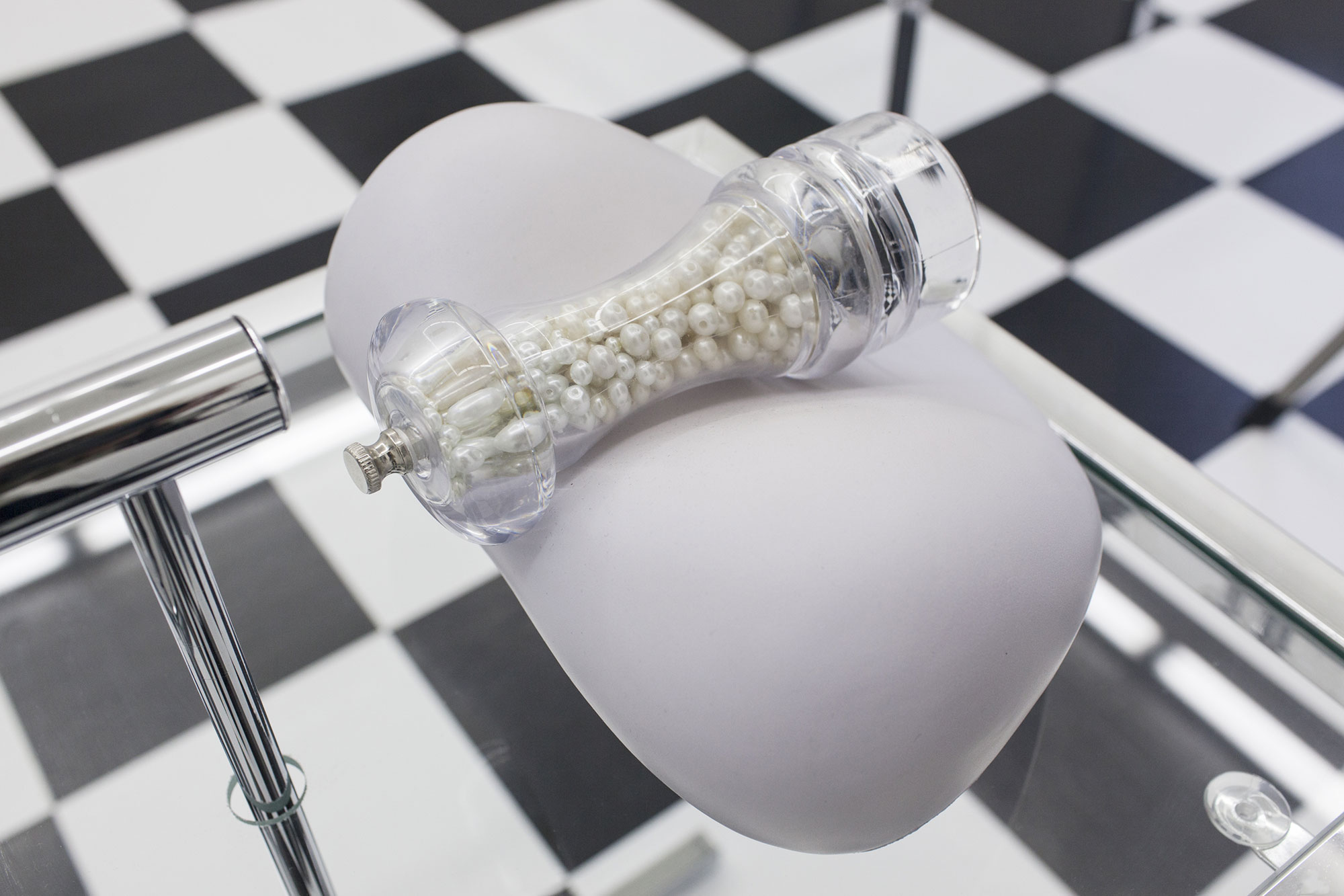 Debora Delmar Corp., Cetrepiece, 2014, neck pillow, pepper grinder, real and fake pearls, 20 x 20 cm. Courtesy of the artist and Kimberly Klark.